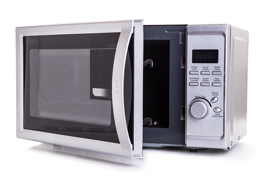 Silver microwave oven with open door on white background - Beardstown, IL